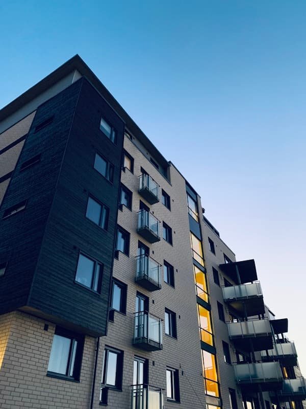 Modern apartment building representing the Vizag Properties platform